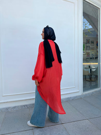 Red high low blouse.