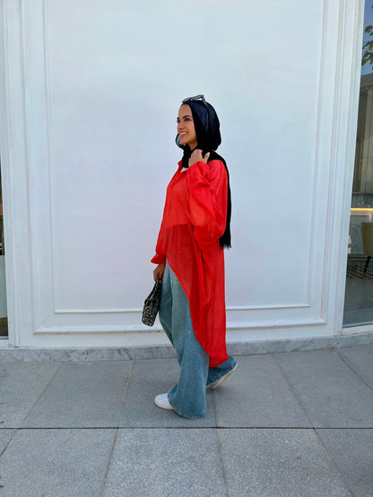 Red high low blouse.